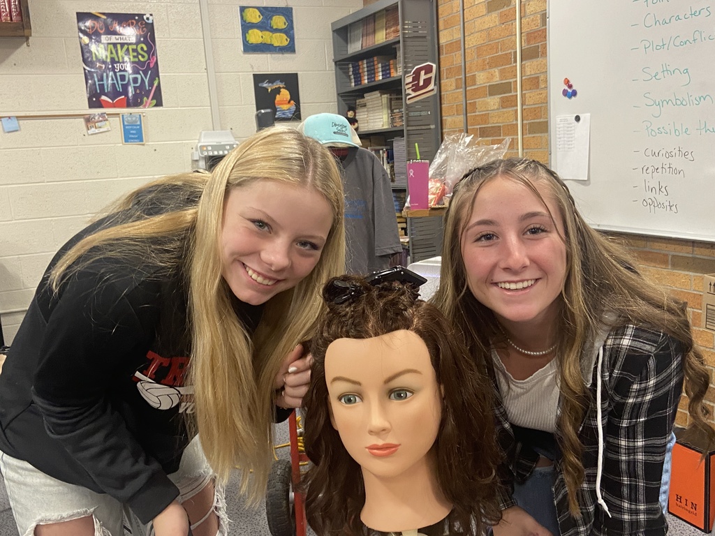 Two students with mannequin head